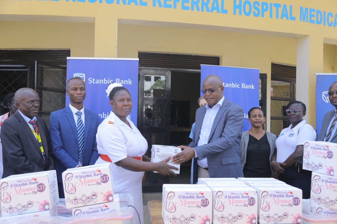 Stanbic Uganda Holdings Chief Executive, Francis Karuhanga (R) handing over a Mamakit of the Mbale Referral Hopsital Management on Wednesday Afternoon.