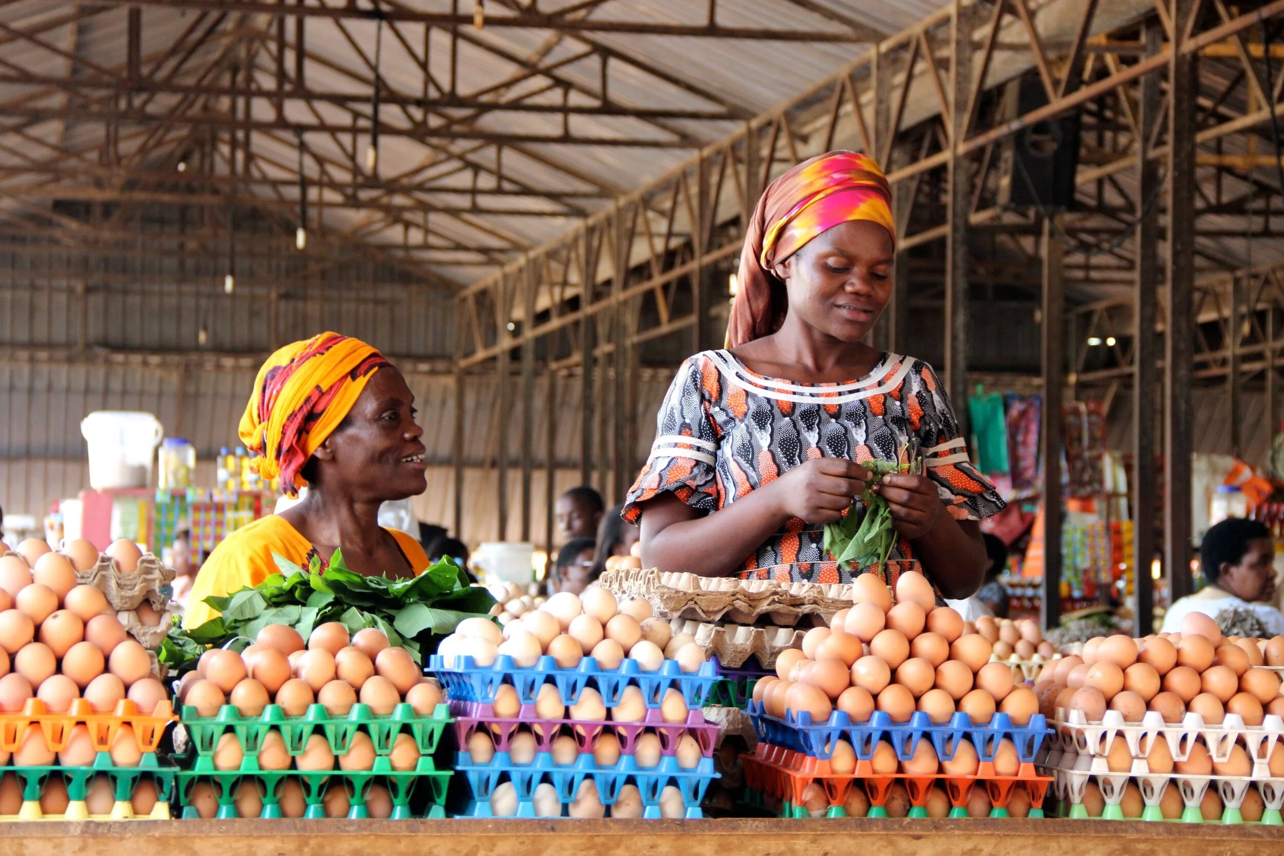 Women attending to a stall selling eggs