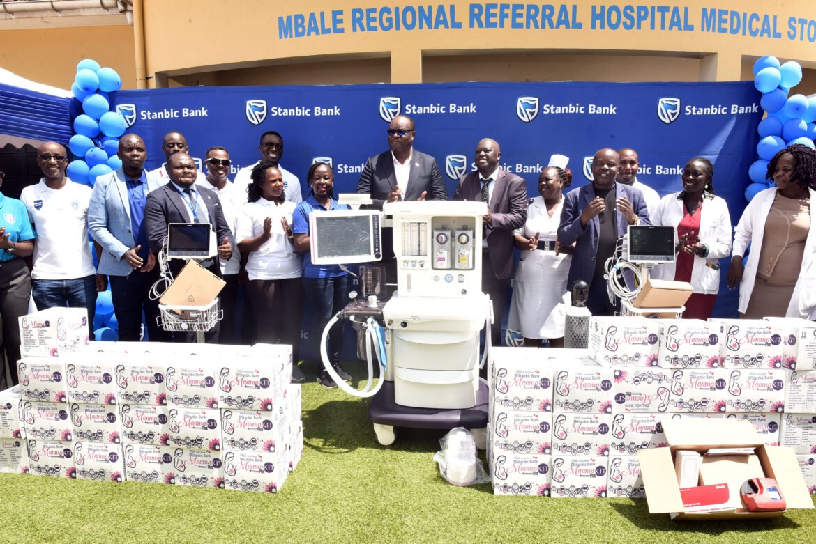Stanbic Bank delegation led by Chief Executive Mumba Kalifungwa (C) handing over Medical equipment to Mbale Hospital leadership and RCC Hamza Banja